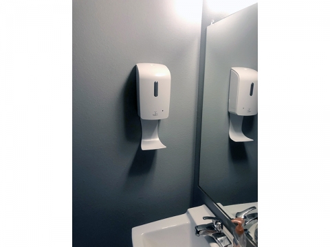 Hand Sanitizer Dispenser Mounted to Bathroom Wall