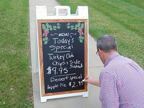 Valet with Man Writing on Chalk Surface 