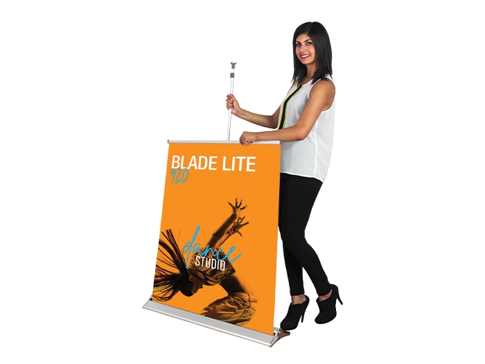 Blade Lite 850 Retractable Banner Stand with Person Pulling up Banner from the Base